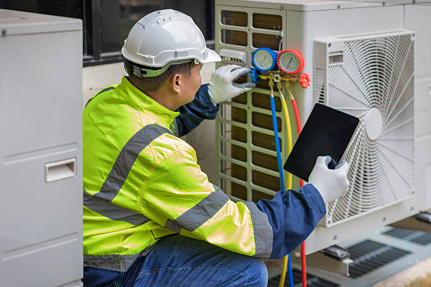 Professional Hvac technician working in Monticello, IL